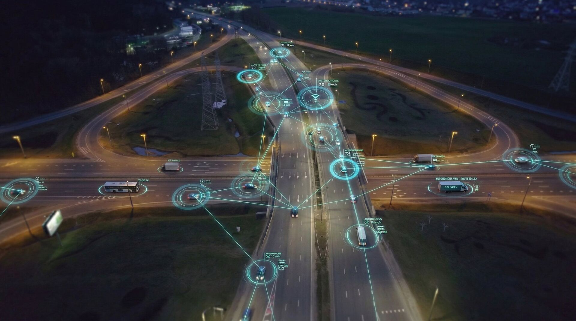 Aerial view of intelligent transportation system with connected vehicles and IoT sensors on a highway interchange